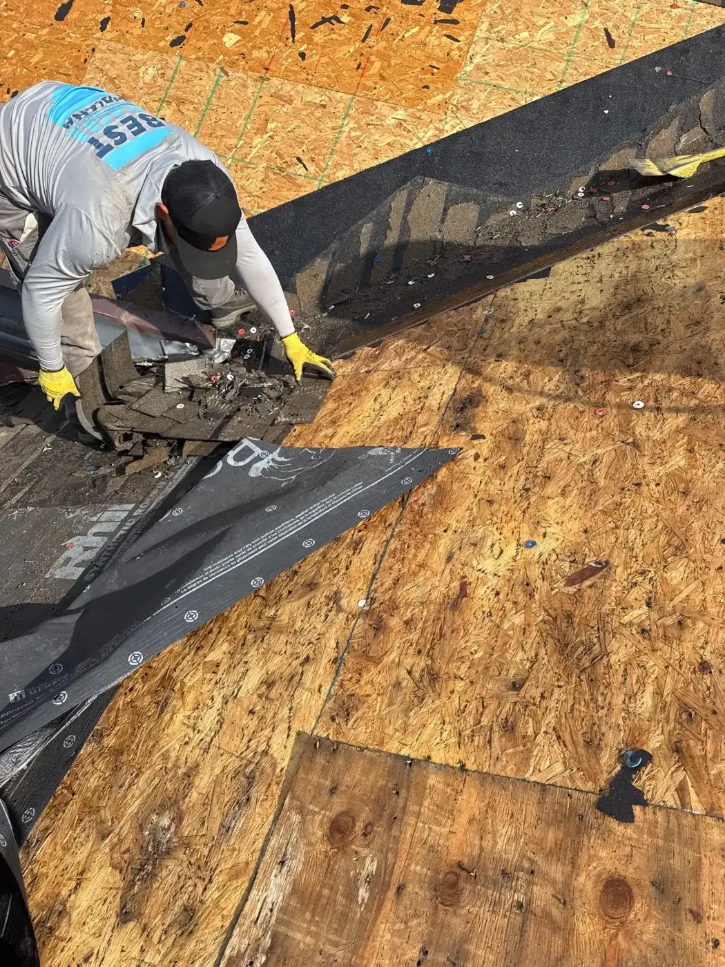 Tarping and dry-in on a Mass Ave commercial roof